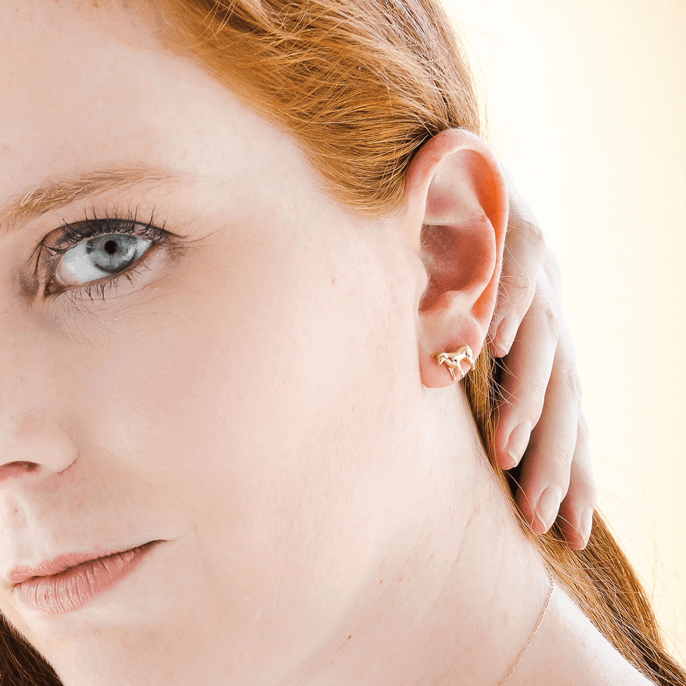 14K yellow gold Year of the Ox zodiac earrings ear studs designer fine jewelry on model